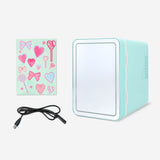 Flying Tiger Copenhagen cosmetics fridge with mirror, LED light, and colorful stickers, measuring 25x25 cm for personal care storage.