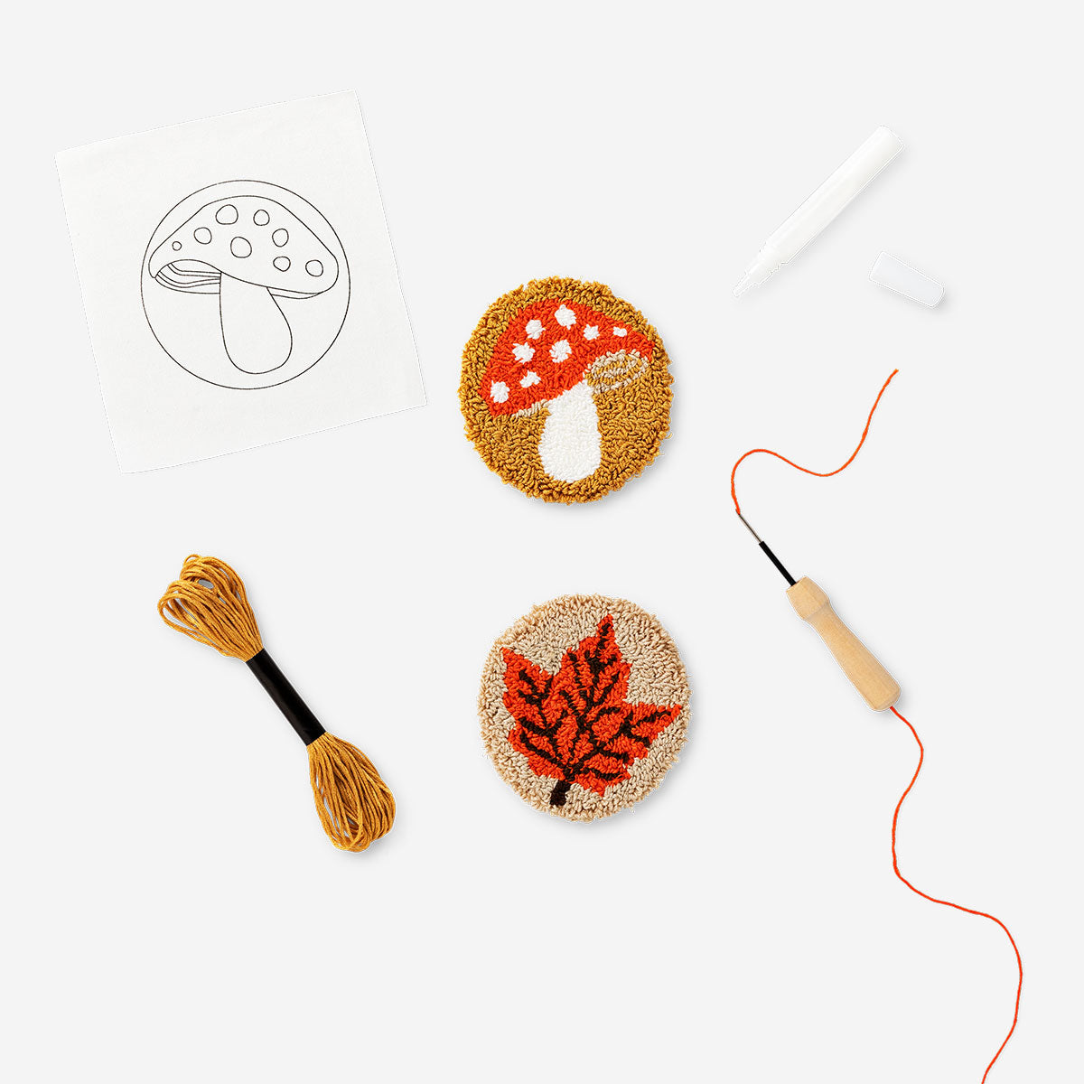 Two DIY punch needle coasters with colorful patterns, perfect for crafting hobbies by Flying Tiger Copenhagen.