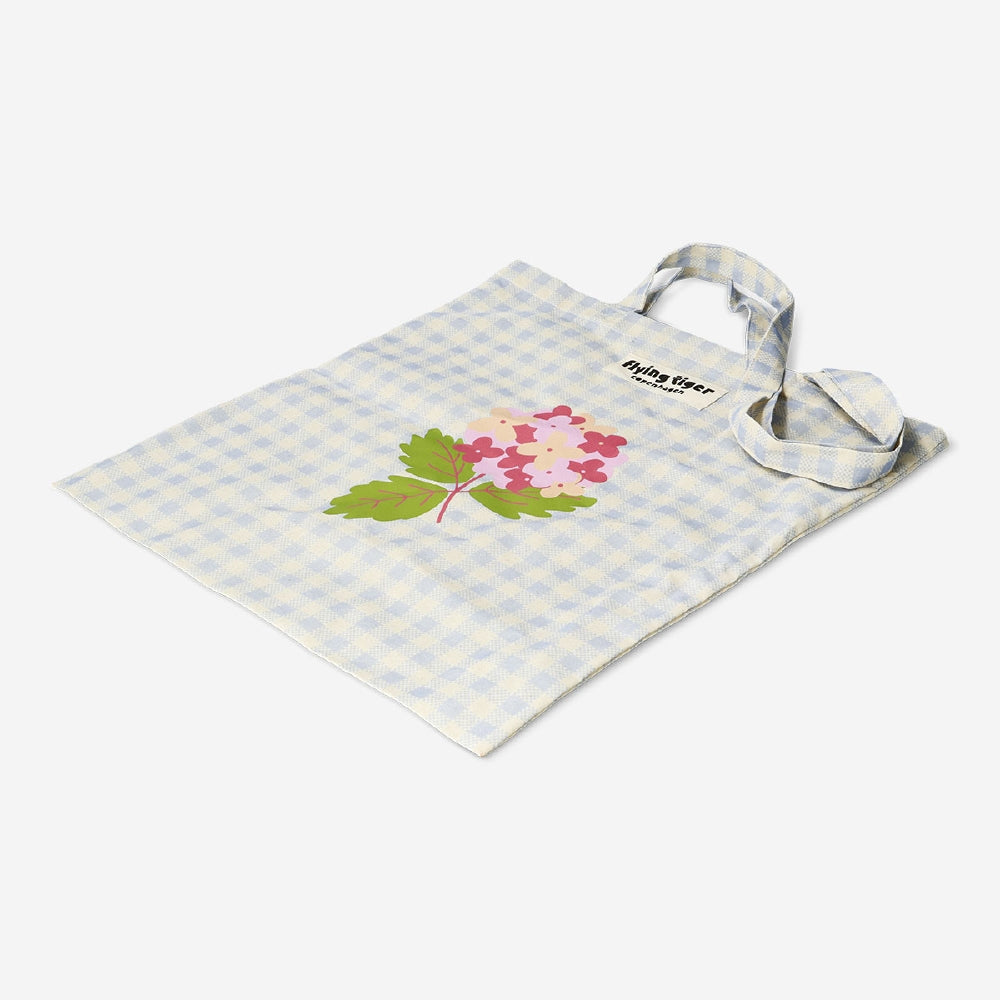 Flying Tiger Copenhagen floral and check print tote bag made of textile with colorful flower and check pattern.