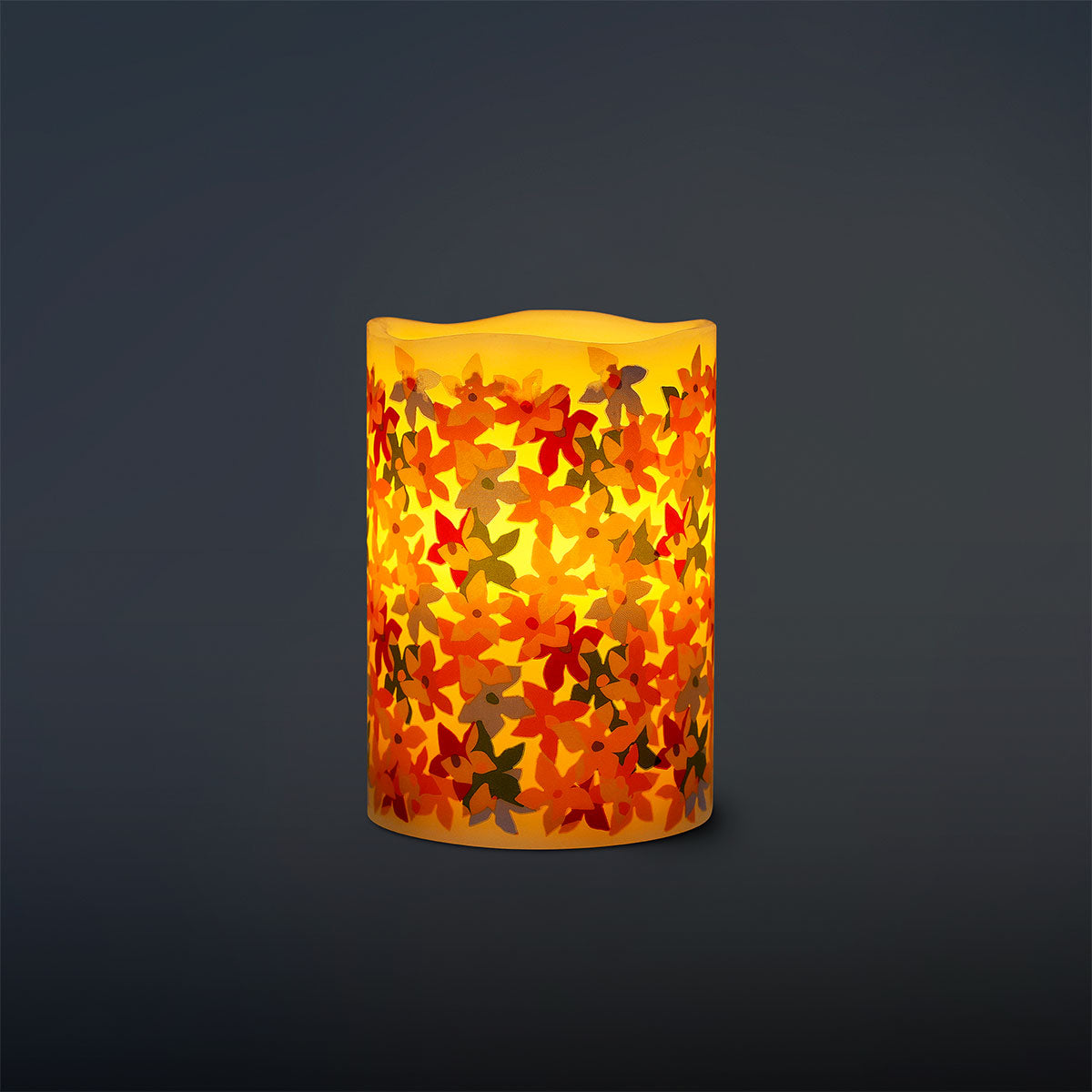 Flying Tiger Copenhagen LED pillar candle with floral print, 10 cm tall, creates a cozy home ambiance with decorative floral design.