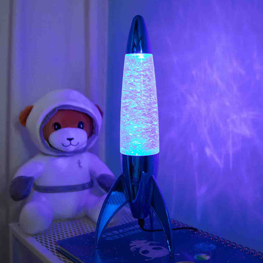 Cosy lamp. Rocket with swirling glitter