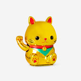 Decorative gold cat gadget with waving design from Flying Tiger Copenhagen, featuring a shiny, stylish feline figure for home decor.