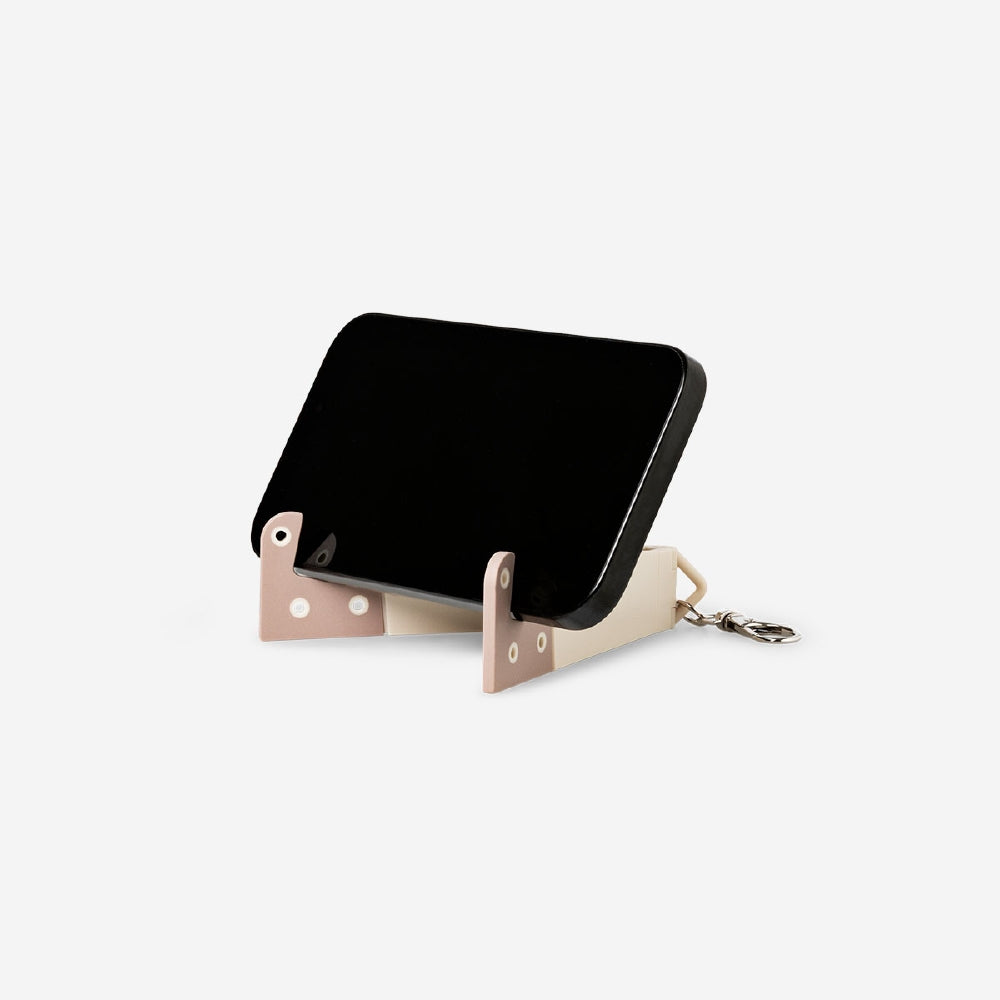 Flying Tiger Copenhagen media phone stand with key ring, black plastic holder for hands-free viewing and easy key attachment.