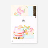 Office birthday card featuring colorful cake, balloons, and flowers from Flying Tiger Copenhagen.