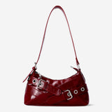 Red textile shoulder bag with buckle details from Flying Tiger Copenhagen, featuring a stylish and functional design.