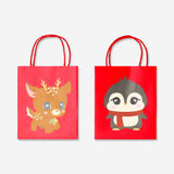Two cute Christmas character gift bags from Flying Tiger Copenhagen, designed for office gift wrapping, featuring festive holiday illustrations.