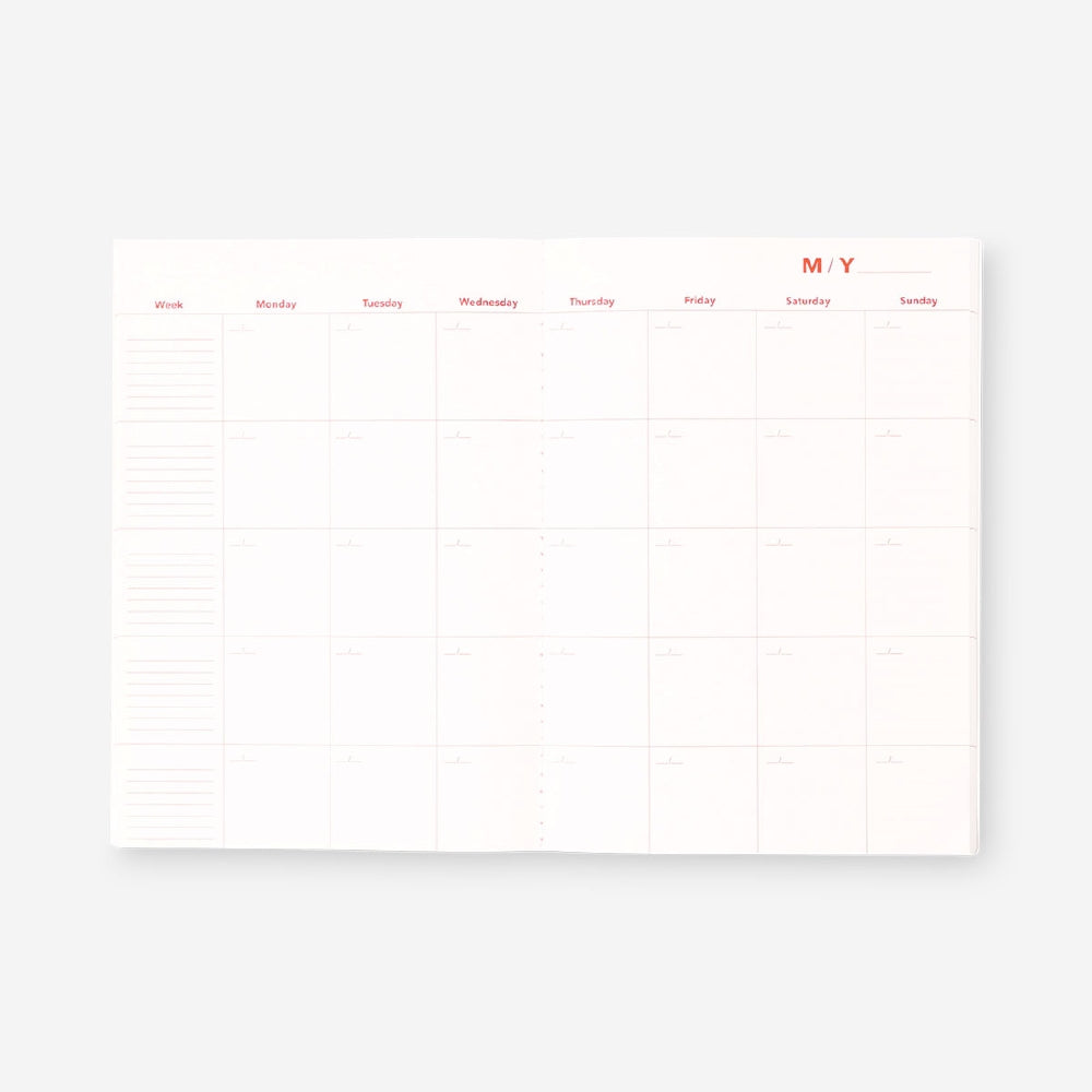Flying Tiger Copenhagen monthly planner notebook for office use, featuring a clean, organized layout with date and scheduling pages.