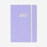 Purple A5 daily diary for 2027 by Flying Tiger Copenhagen, featuring a sleek office-style cover and daily planning pages.