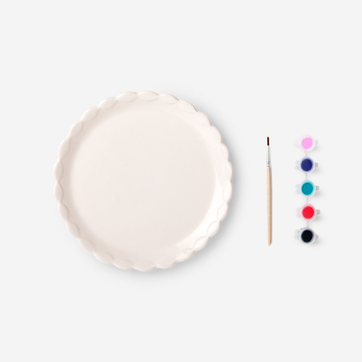 Decorative 20 cm DIY hobby plate by Flying Tiger Copenhagen, showcasing a colorful, creative design on a ceramic surface.