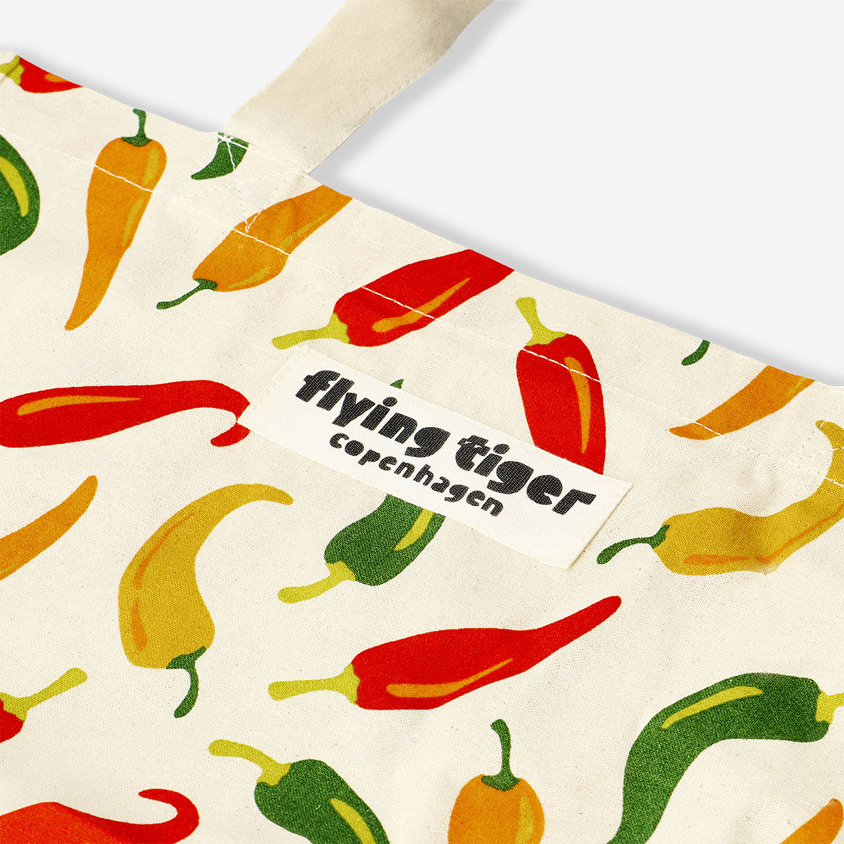 Flying Tiger Copenhagen textile tote bag featuring a colorful chillies design, perfect for carrying daily essentials.