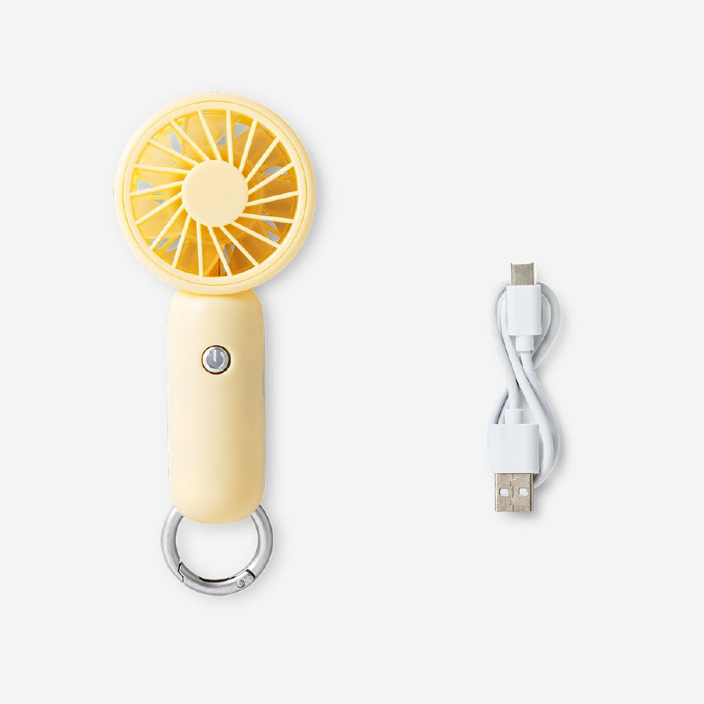 Yellow handheld gadget fan with three speed settings from Flying Tiger Copenhagen, compact and portable for personal cooling.