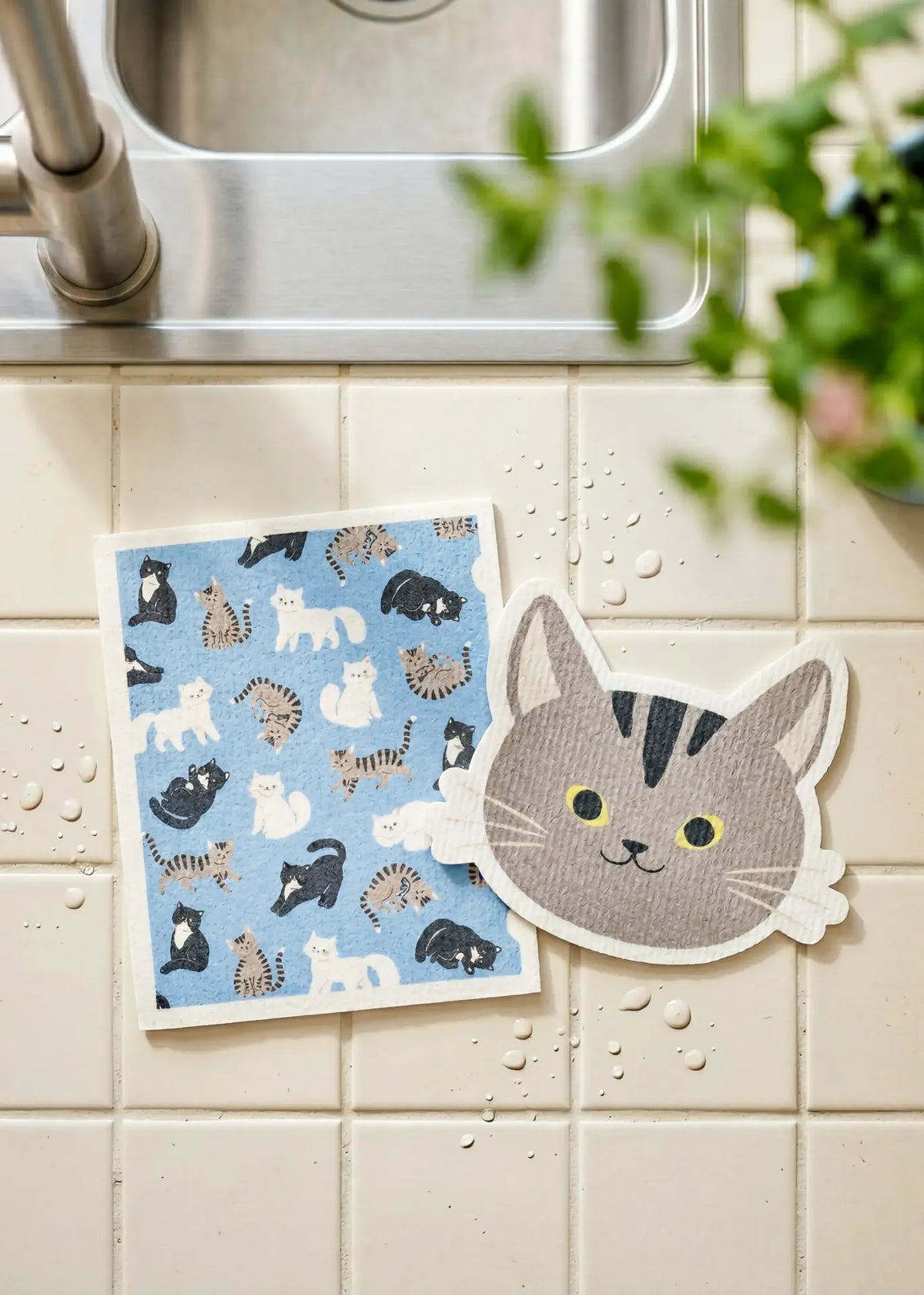 Set of two Flying Tiger Copenhagen cat-themed kitchen cloths featuring colorful cat designs for cleaning and kitchen use.