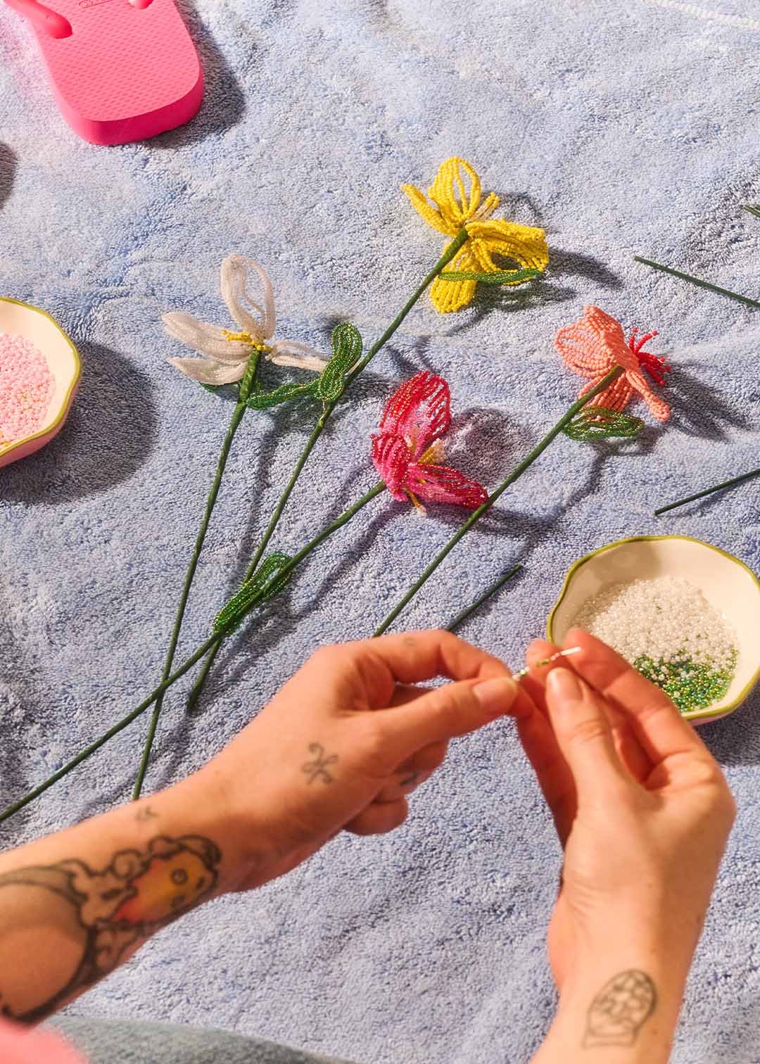 Colorful DIY beaded flower craft kit from Flying Tiger Copenhagen, featuring vibrant beads and floral design for hobbies and creative projects.