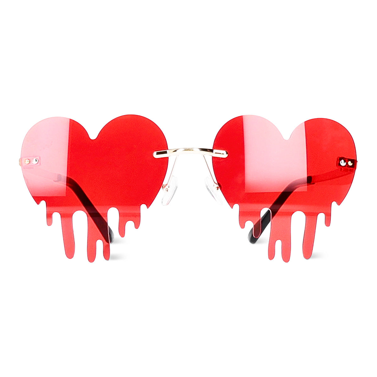 Red drip hearts party glasses by Flying Tiger Copenhagen with heart-shaped design for festive celebrations.