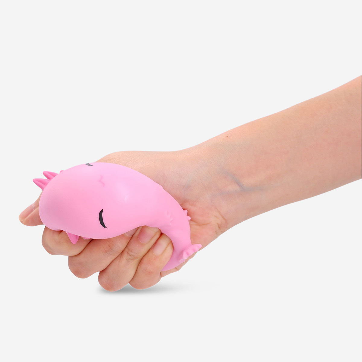 Pink axolotl press me gadget toy from Flying Tiger Copenhagen, featuring a cute, squeezable design and playful appearance.