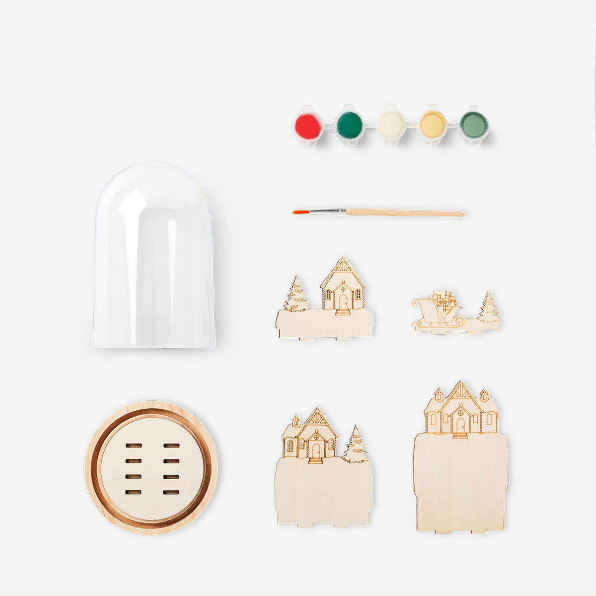 DIY wooden Christmas scene snowglobe hobby kit by Flying Tiger Copenhagen featuring a festive winter display with snow and miniature figures.