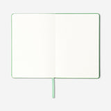 A5 green bullet planner from Flying Tiger Copenhagen, designed for office organization with a sleek cover and compact size.