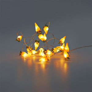 Flying Tiger Copenhagen orange carrot string lights for home decor, featuring bright carrot-shaped bulbs on a festive string.