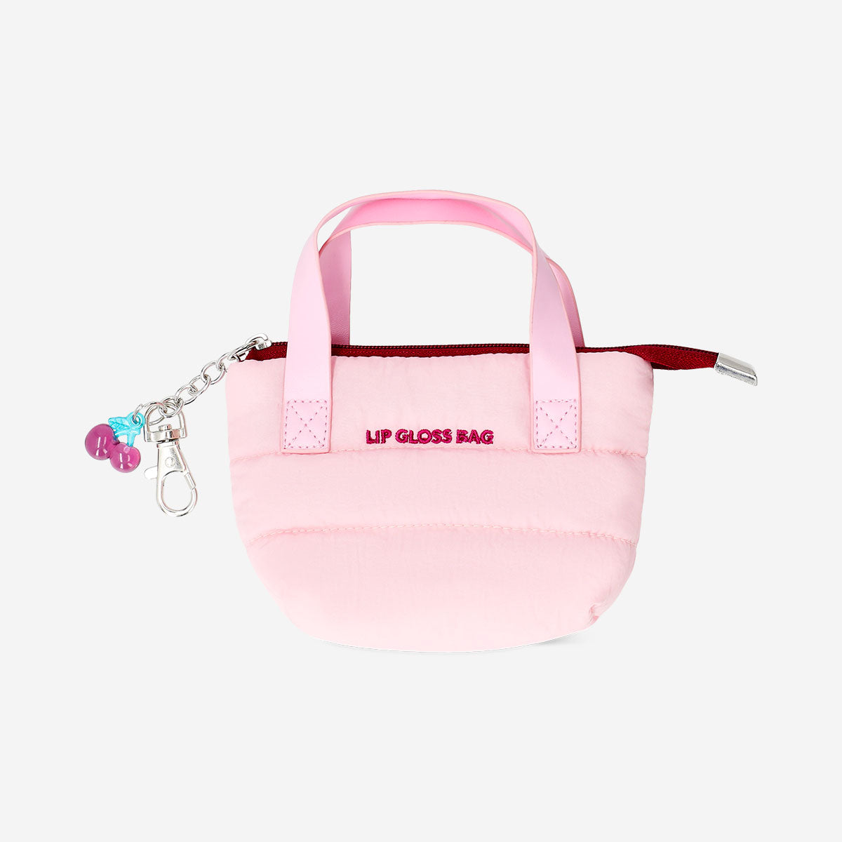 Mini toiletry bag for lip gloss from Flying Tiger Copenhagen, featuring a cherry charm and compact personal care design.