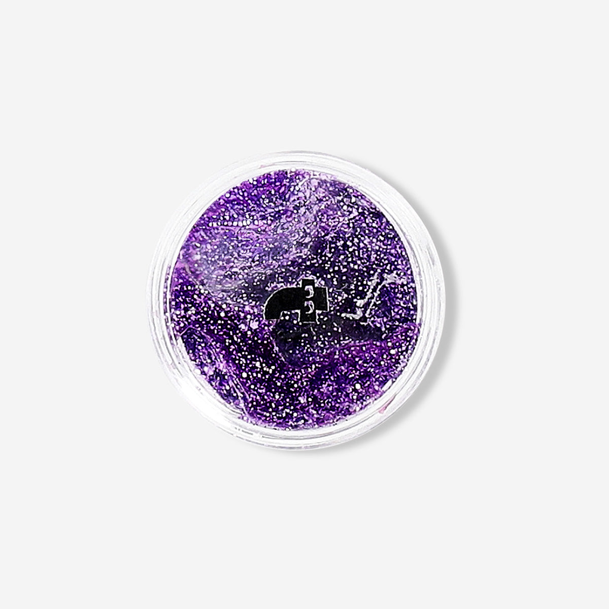 Purple glitter eyeshadow flakes from Flying Tiger Copenhagen, shown in a close-up of shimmering cosmetic flakes for eye makeup.