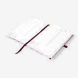 A5 lilac undated personal planner from Flying Tiger Copenhagen with a smooth cover and open pages for notes and planning.