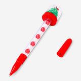Flying Tiger Copenhagen Christmas tree snowglobe ballpoint pen, festive office accessory with holiday-themed design.