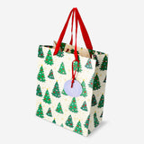 Office gift bag with embossed Christmas trees by Flying Tiger Copenhagen, featuring festive holiday tree patterns.