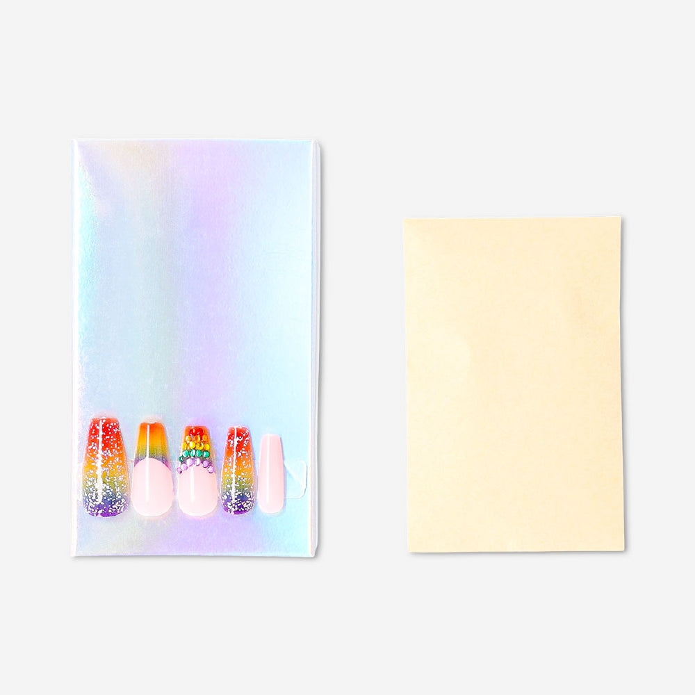 Flying Tiger Copenhagen rainbow rhinestone press-on nails with colorful, sparkling embellishments for a stylish personal care look.