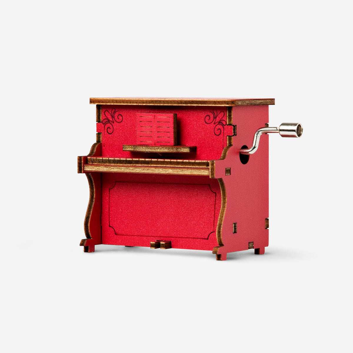 Flying Tiger Copenhagen DIY music box gadget with colorful components and small mechanical parts on a white background.