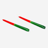 Pair of red and green dinner candles from Flying Tiger Copenhagen, ideal for home decoration and table setting.