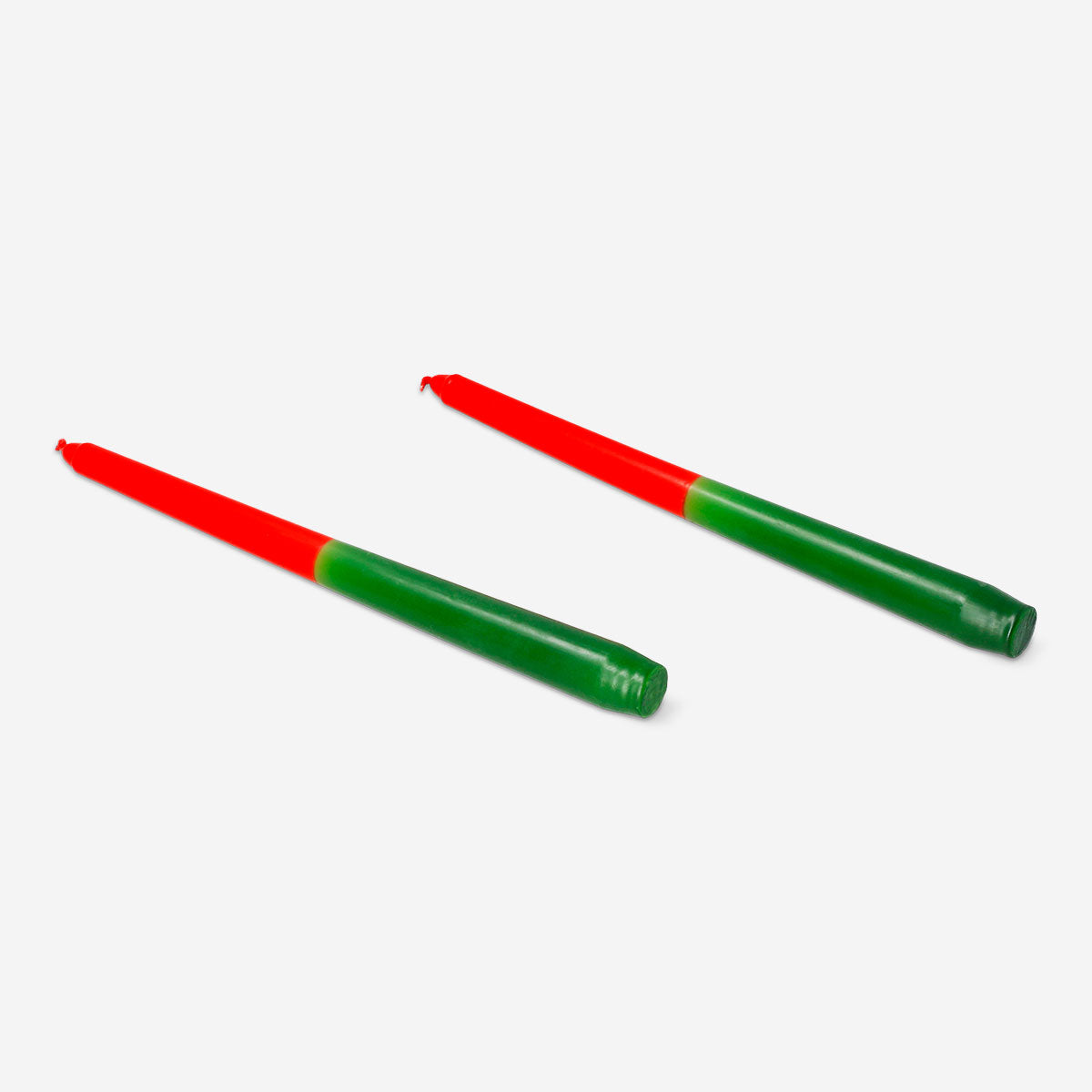 Pair of red and green dinner candles from Flying Tiger Copenhagen, ideal for home decoration and table setting.