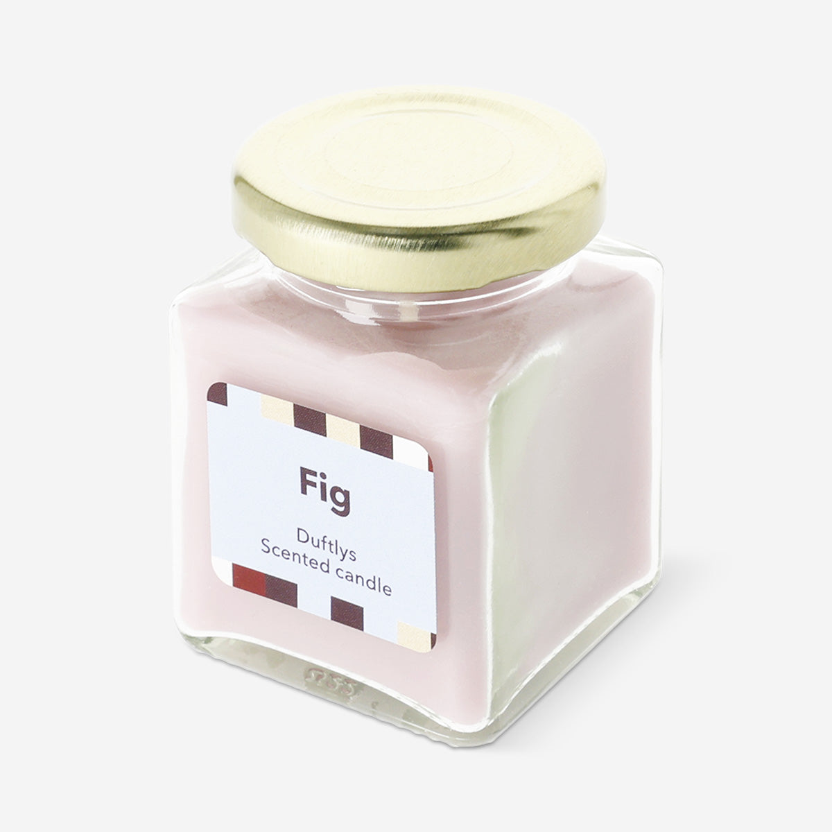 Flying Tiger Copenhagen scented candle with fig fragrance, featuring a sleek glass container and warm, inviting glow for home ambiance.