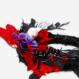 Halloween wreath with orange and black decorations, 20 cm size, perfect for Halloween home decor from Flying Tiger Copenhagen