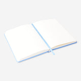 Blue DIY junk journal for office use, featuring layered paper and decorative elements, by Flying Tiger Copenhagen.
