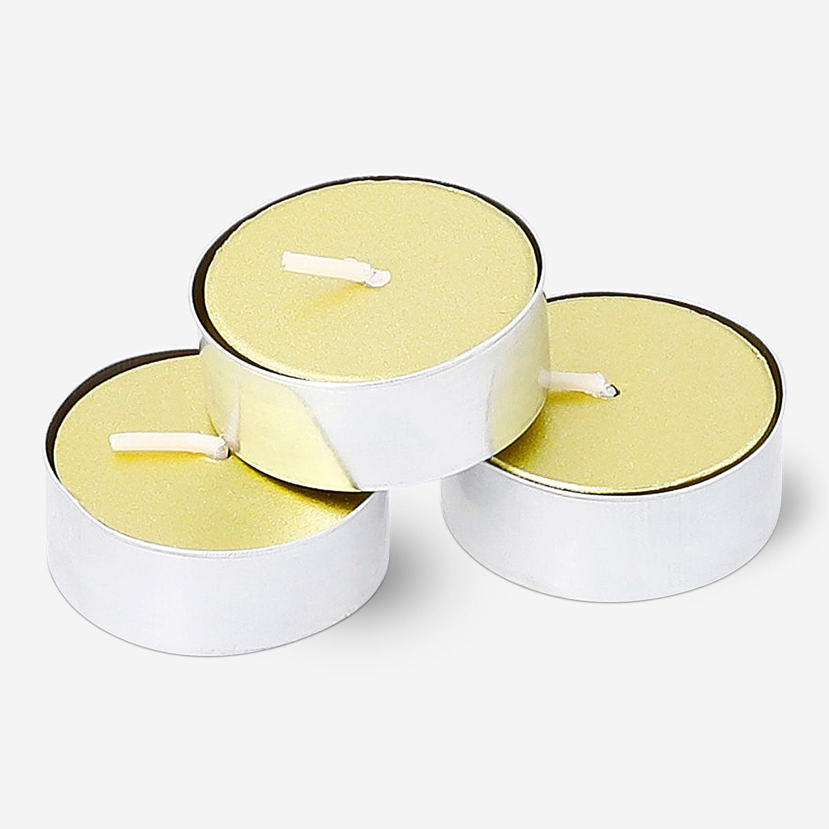 Set of four gold tealights in small glass holders, perfect for home décor and ambient lighting by Flying Tiger Copenhagen.
