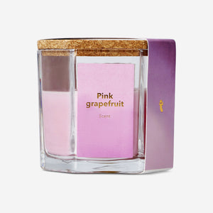 Pink grapefruit scented candle in a glass jar with a cork lid, perfect for home ambiance. Flying Tiger Copenhagen home decor.