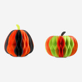 Two honeycomb paper pumpkins party decorations in orange, perfect for festive table decor, by Flying Tiger Copenhagen.