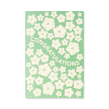 Flying Tiger Copenhagen floral congratulations greeting card with colorful floral design and office-themed message.