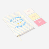 Flying Tiger Copenhagen self-care journal for office use, featuring a spiral-bound design with motivational cover art.