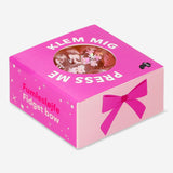 Pink fidget bow gadget from Flying Tiger Copenhagen, a press-me toy designed for stress relief and sensory play.