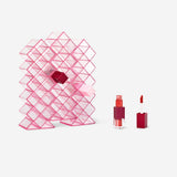 Pink cosmetic organiser for lip glosses, 25x20.5 cm, personal care item by Flying Tiger Copenhagen, with multiple compartments.