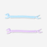 Two Fidget Dog Bracelets toy by Flying Tiger Copenhagen featuring colorful, flexible dog-shaped fidget toys for stress relief.