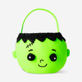 Green zombie trick or treat bucket for Halloween party from Flying Tiger Copenhagen, featuring a spooky zombie design.