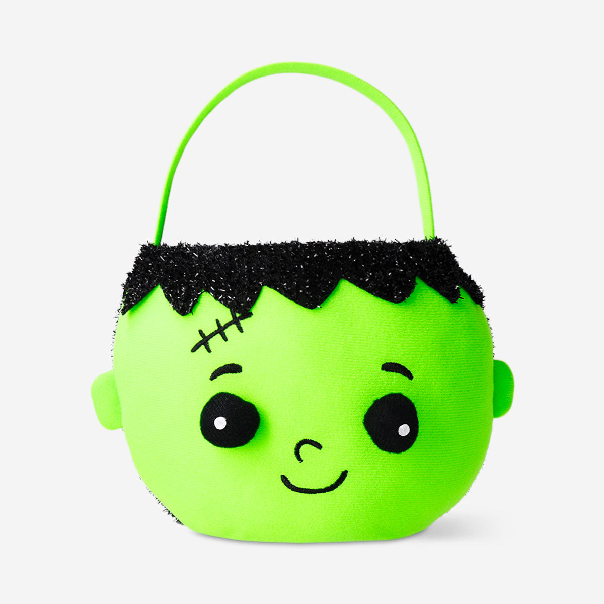 Green zombie trick or treat bucket for Halloween party from Flying Tiger Copenhagen, featuring a spooky zombie design.