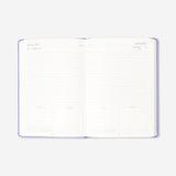 Purple A5 daily diary for 2027 by Flying Tiger Copenhagen, featuring a compact office planner with a hardcover design.