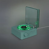 Flying Tiger Copenhagen wireless speaker with vinyl record design and built-in light, portable media device for music playback.
