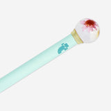 Turquoise pen with flower globe