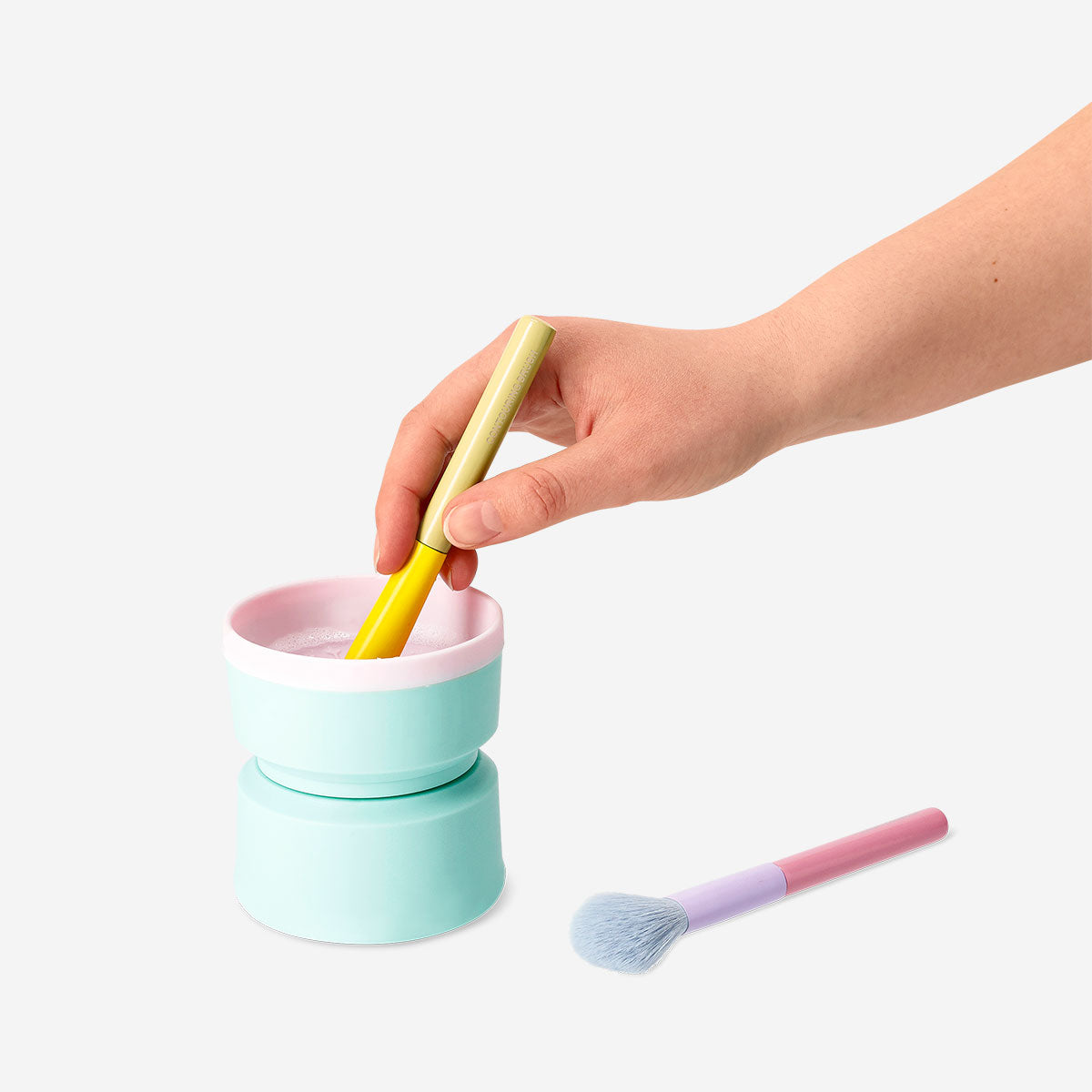 Flying Tiger Copenhagen makeup brush cleaning machine for personal care, showing the device used to clean cosmetic brushes.