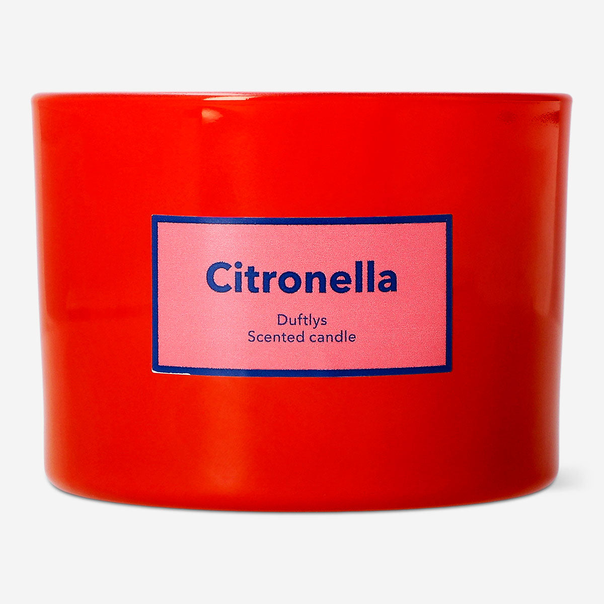 Flying Tiger Copenhagen scented outdoor candle with citronella fragrance, shown burning in a decorative holder for outdoor ambiance.