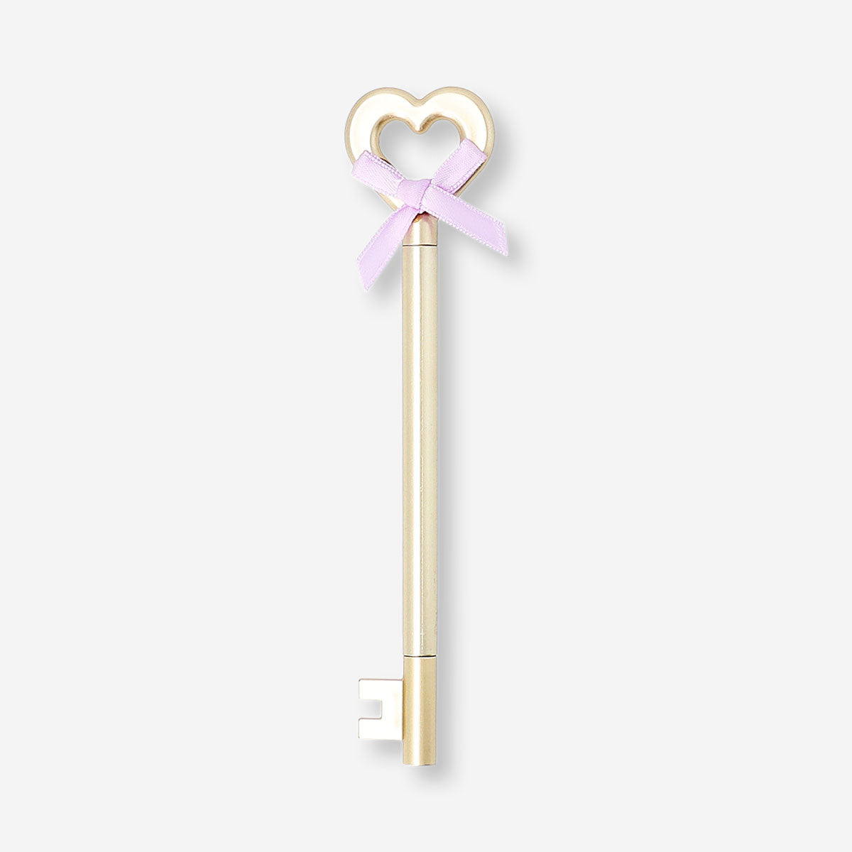 Gold ballpoint pen with a key and bow design, Flying Tiger Copenhagen office accessory, stylish writing instrument.